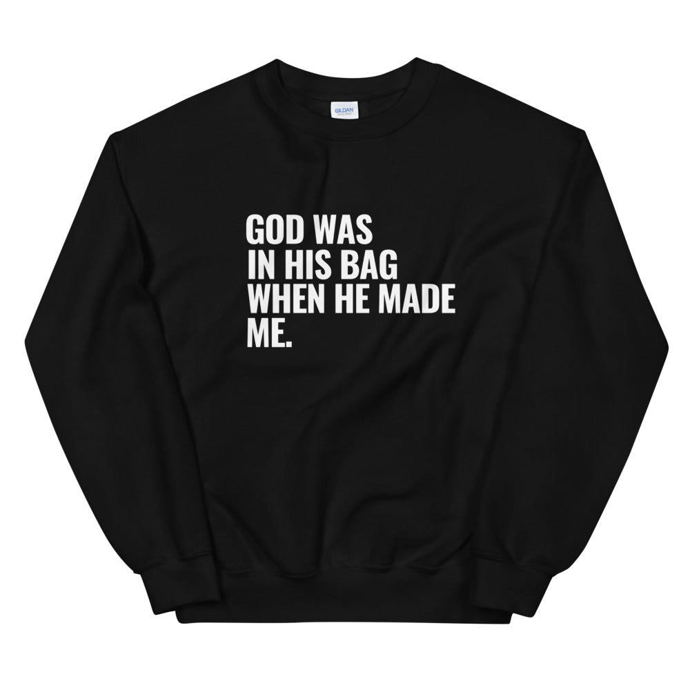 Black crewneck sweatshirt with writing. God was in his bag when he made me.